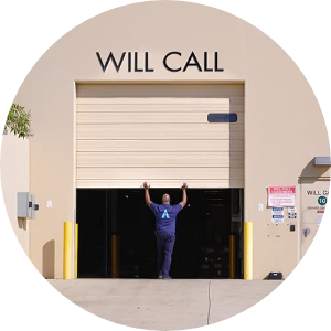 Essendant - Employee Closes Will Call Loading Dock Door - Rear View